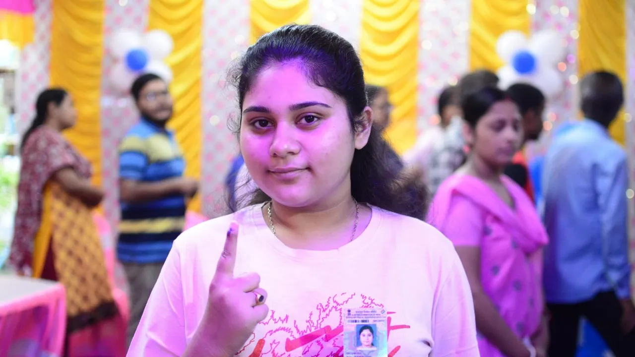 A voter shows her finger marked with indelible ink after casting vote during Naihati assembly constituency bypoll, in North 24 Parganas district, West Bengal.