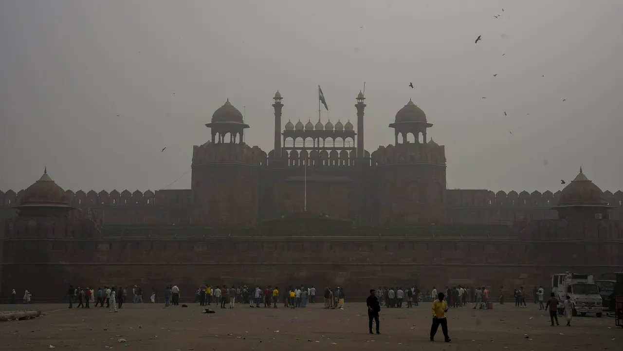 Visitors at the Red Fort amid fog, in New Delhi, Wednesday, Nov. 13, 2024.
