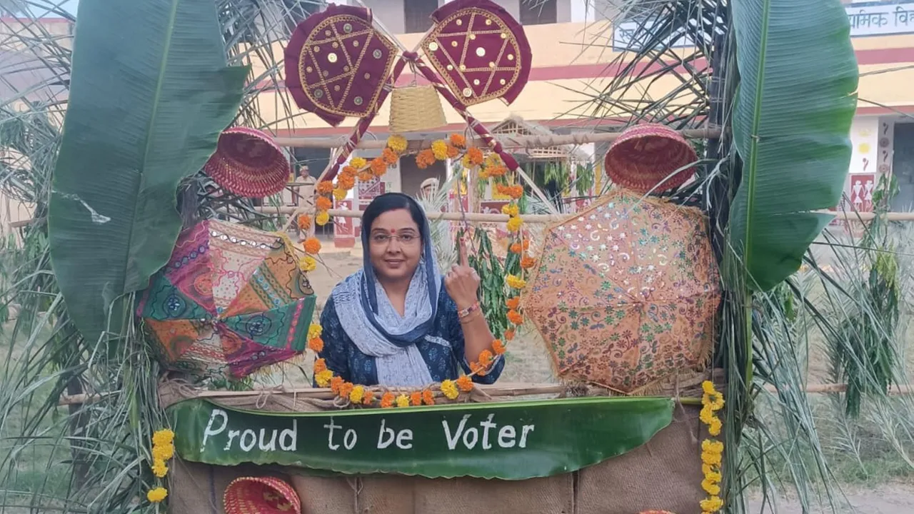 A voter shows her finger marked with indelible ink after casting vote during Rajasthan assembly constituency by-election.