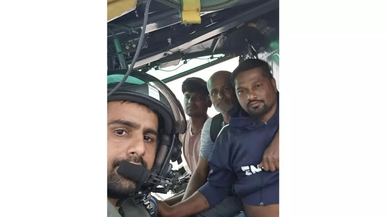 The Indian Coast Guard (ICG) rescuing five persons from a flooded fishing boat in the Arabian sea off Daman coast