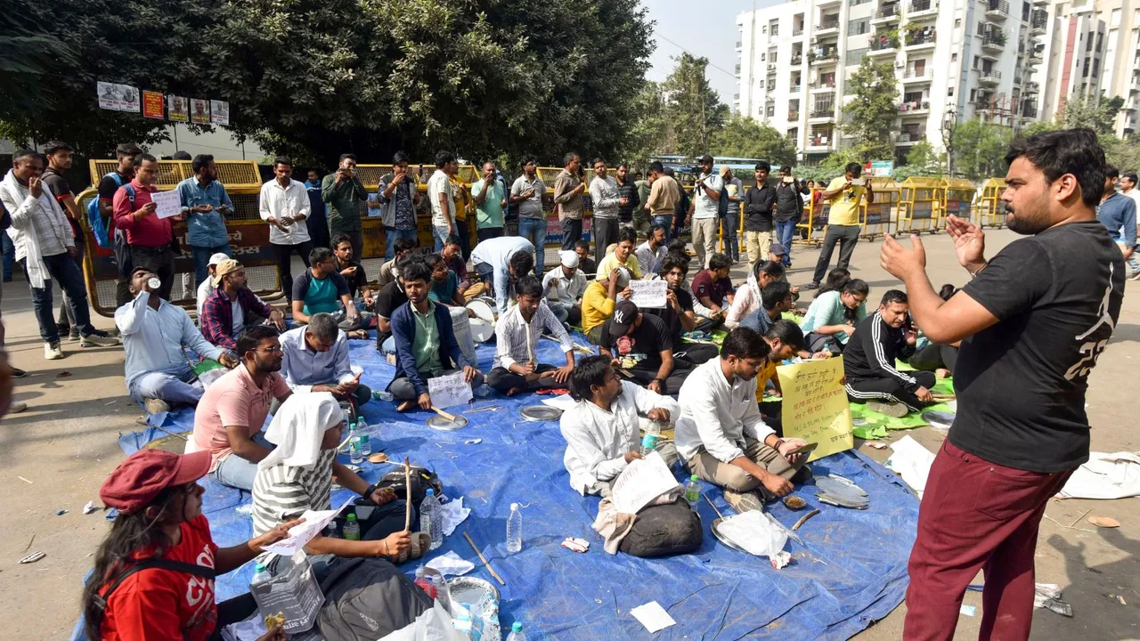 Aspirants stage a protest against the UPPSC, demanding the implementation of 'Single Day, Single Sheet' exams, in Prayagraj, Friday, Nov. 15, 2024.