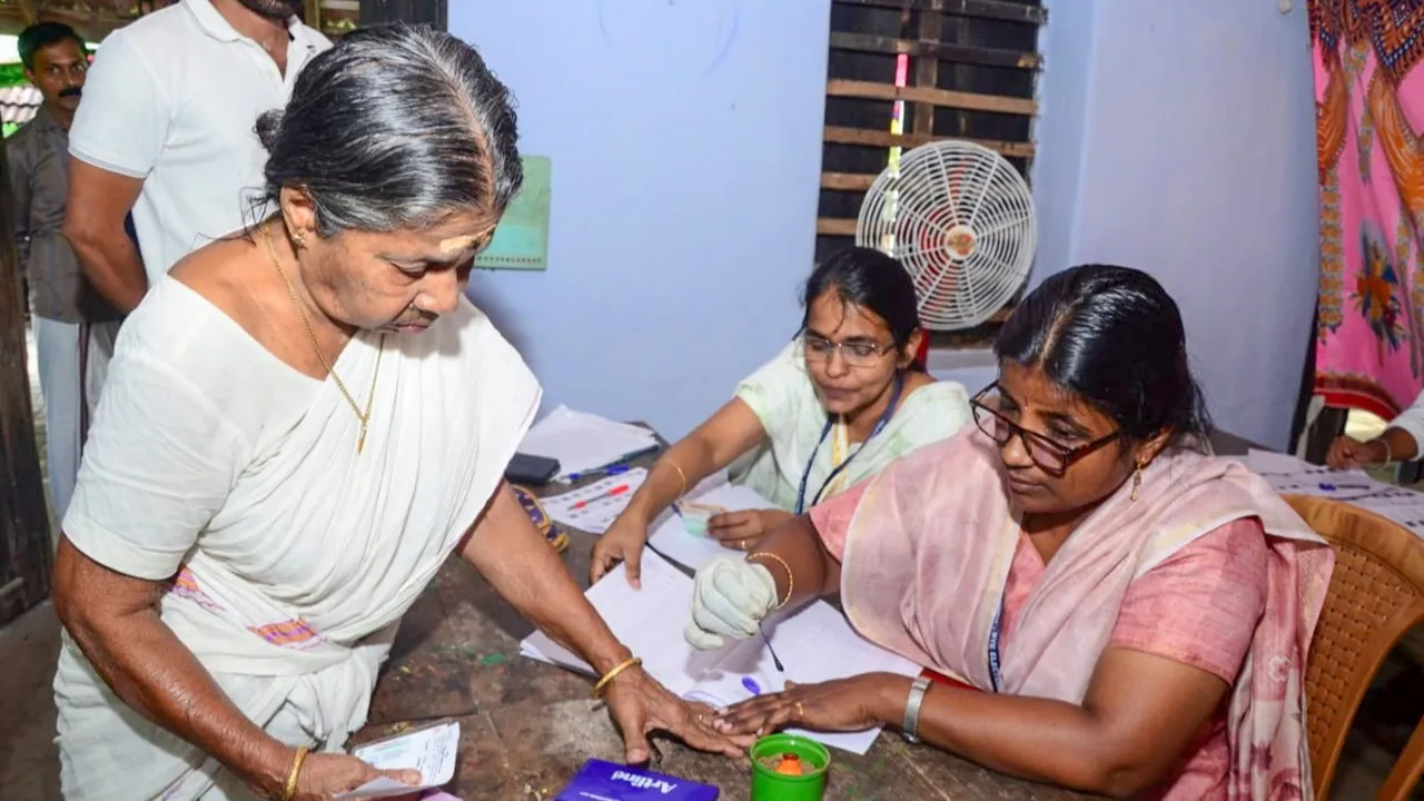 A voter gets her finger marked with indelible ink before casting vote during Kerala's Palakkad Assembly constituency bypoll, in Palakkad, Kerala, Wednesday, Nov. 20, 2024.