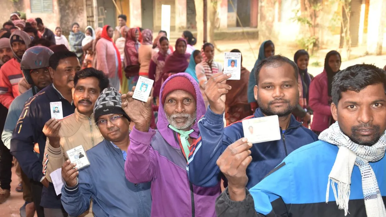 People stand in a queue to cast votes at a polling station during the final phase of Jharkhand Assembly Elections, in Ranchi district, Wednesday, Nov. 20, 2024