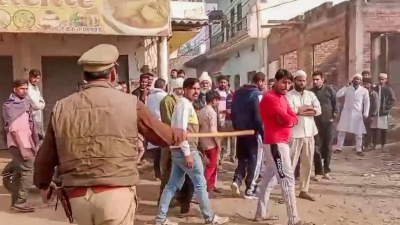 Police personnel tries to maintain law and order after an alleged incident of stone pelting during UP's Meerapur Assembly constituency bypoll, in Muzaffarnagar, UP, Wednesday, Nov. 20, 2024.