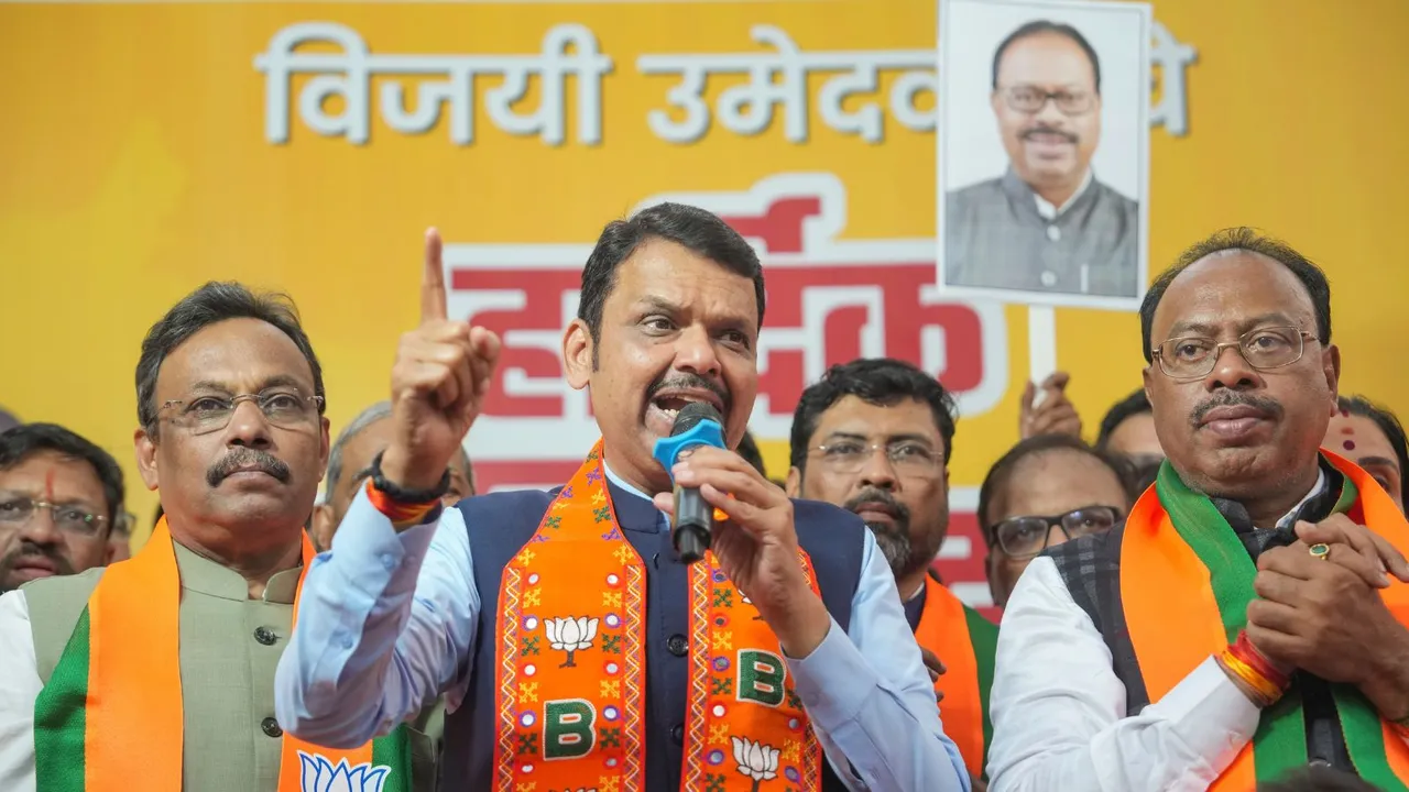 Maharashtra Deputy Chief Minister and BJP leader Devendra Fadnavis interacts with party workers after securing victory in the Maharashtra Assembly elections, at BJP office in Mumbai, Saturday, Nov. 23, 2024.