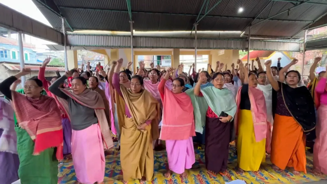 People raise slogans during a protest against the recent violence in Manipur and reimposition of AFSPA in parts of the state, in Imphal