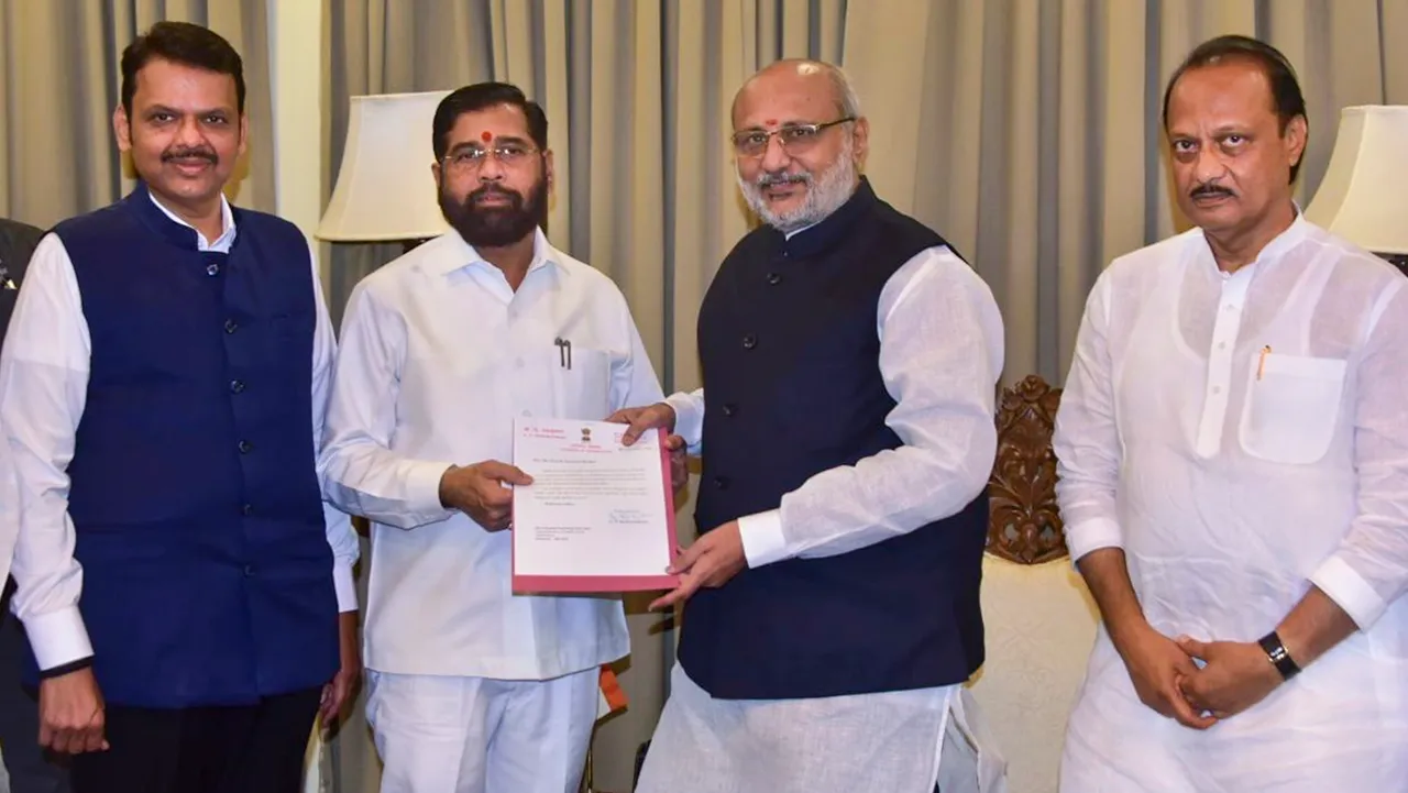 Maharashtra Governor C.P. Radhakrishnan receives Shiv Sena leader Eknath Shinde's resignation as state chief minister, as BJP leader Devendra Fadnavis and NCP leader Ajit Pawar look on, in Mumbai, Tuesday, Nov. 26, 2024