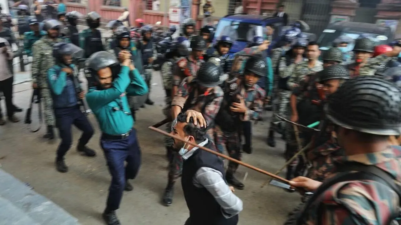 Law enforcers charge batons to disperse followers gathered to demand the release of their leader Chinmoy Krishna Das, a Hindu leader associated with the International Society for Krishna Consciousness (ISKCON), who appeared at the Chattogram Metropolitan Magistrate Court, in Chattogram, Bangladesh