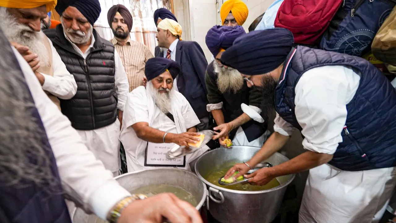 Shiromani Akali Dal leader Sukhbir Singh Badal washes dishes as he serves his Tankhah (religious punishment) at the Golden Temple, in Amritsar, Wednesday, Dec. 4, 2024.