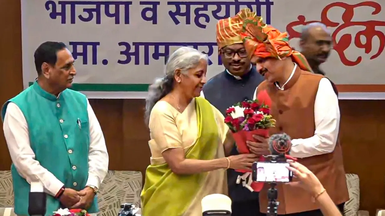 Nirmala Sitharaman felicitates BJP leader Devendra Fadnavis after he was unanimously elected as the Maharashtra BJP legislature party leader at its meeting, in Mumbai.