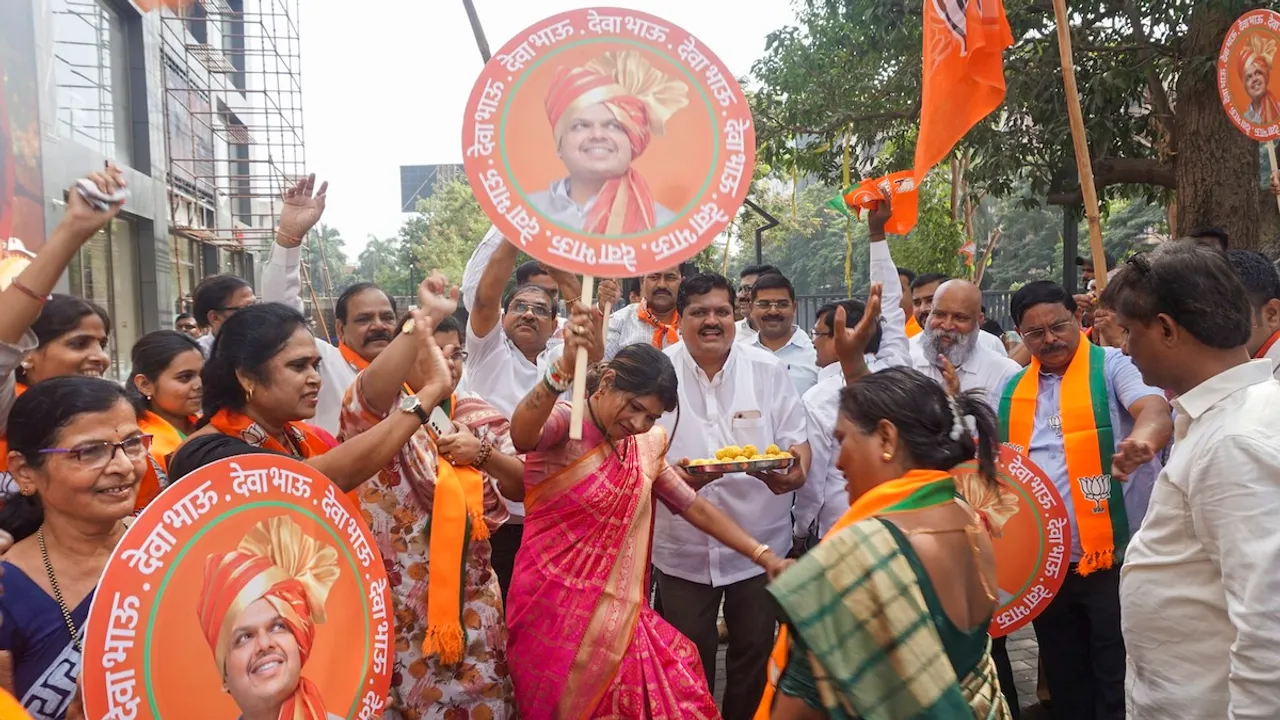 Supporters celebrate with sweets after Devendra Fadnavis was unanimously elected as BJP legislative party leader, paving the way for him to be sworn in as Maharashtra Chief Minister on Wednesday, Dec. 4, 2024.