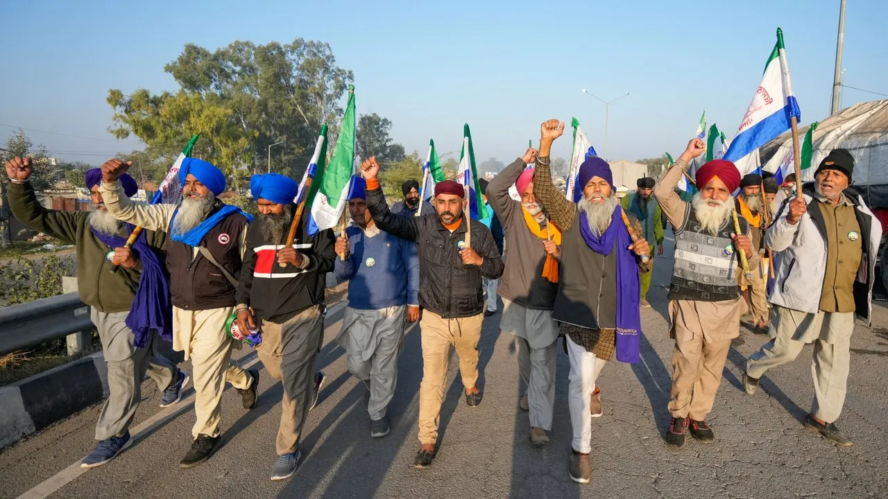 Farmers raise slogans as they gather at Shambhu border ahead of their 'Delhi Chalo' march to the national capital, in Patiala district, Punjab, Friday, Dec. 6, 2024.