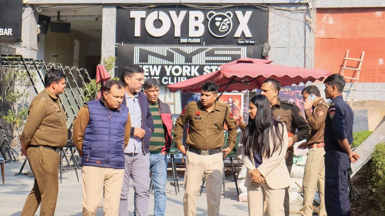 Police personnel investigate at the spot after a low-intensity explosion occurred outside a night club, in Gurugram, Tuesday, Dec. 10, 2024.