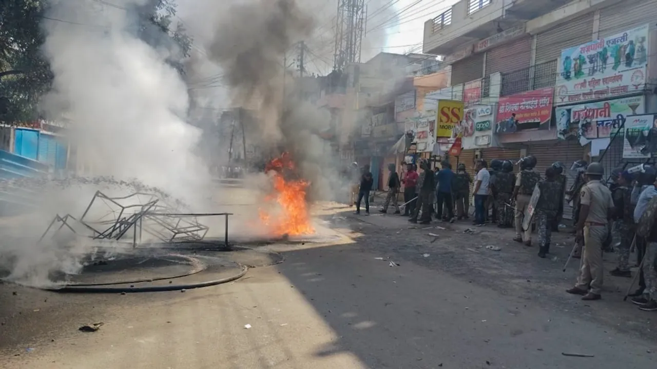 A structure set on fire during protests which continued for the second day over alleged vandalising of a replica of the Indian Constitution in Parbhani, Maharashtra on Wednesday, Dec. 11, 2024.