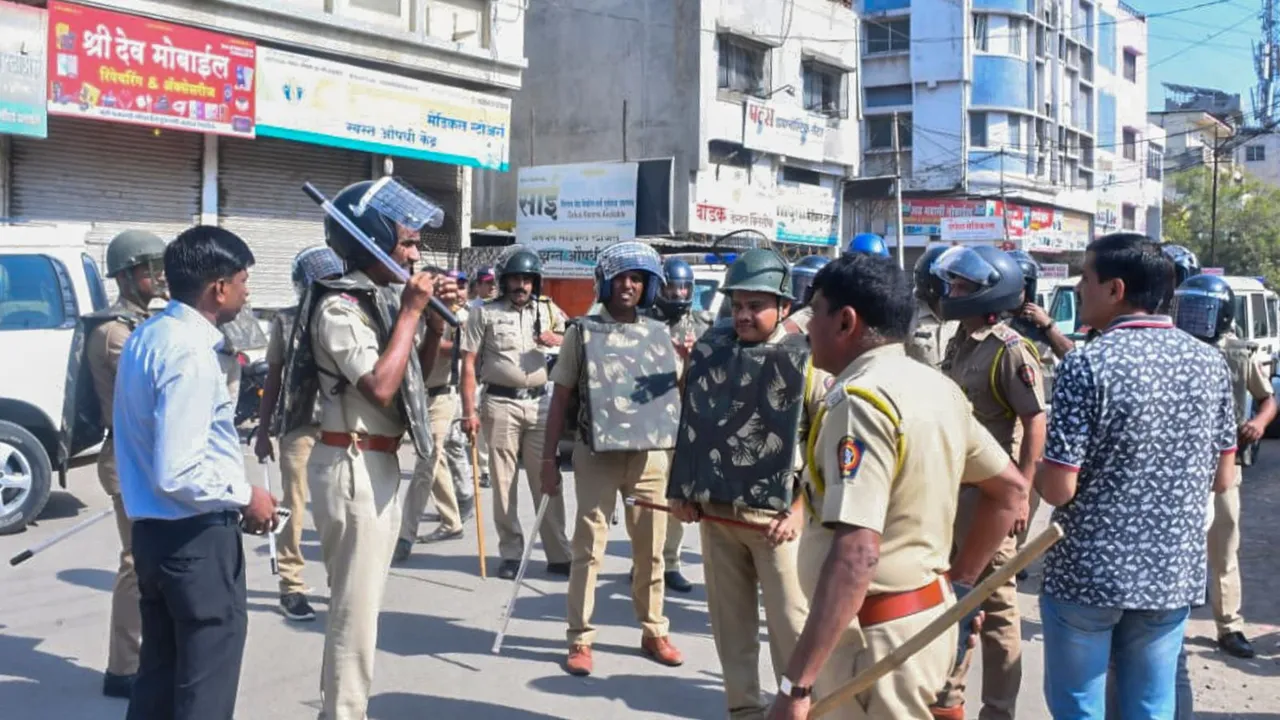 Security personnel keep vigil after violent protests took place for the second day over alleged vandalising of a replica of the Indian Constitution, in Parbhani, Maharashtra