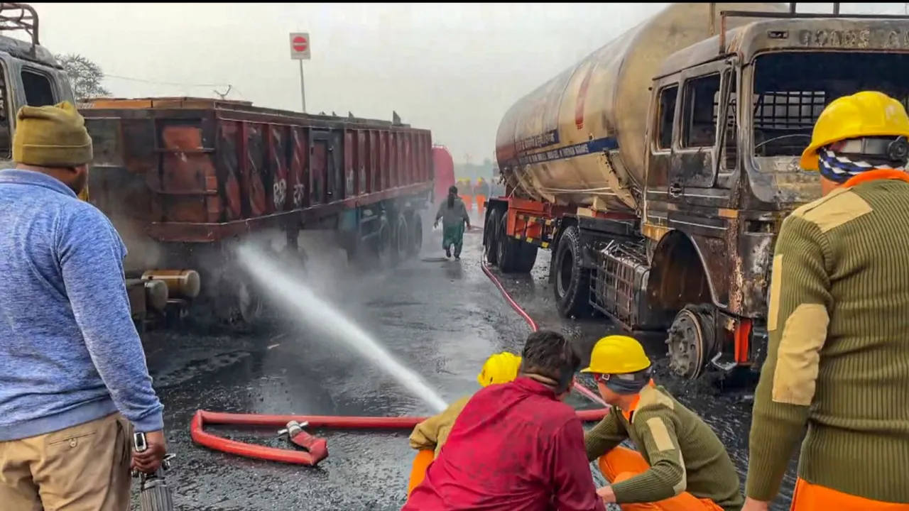 Firefighters extinguish the fire at the site of the accident after a truck loaded with a chemical collided with some other vehicles and caught fire on the Jaipur-Ajmer Highway, in Jaipur, Friday, Dec. 20, 2024.