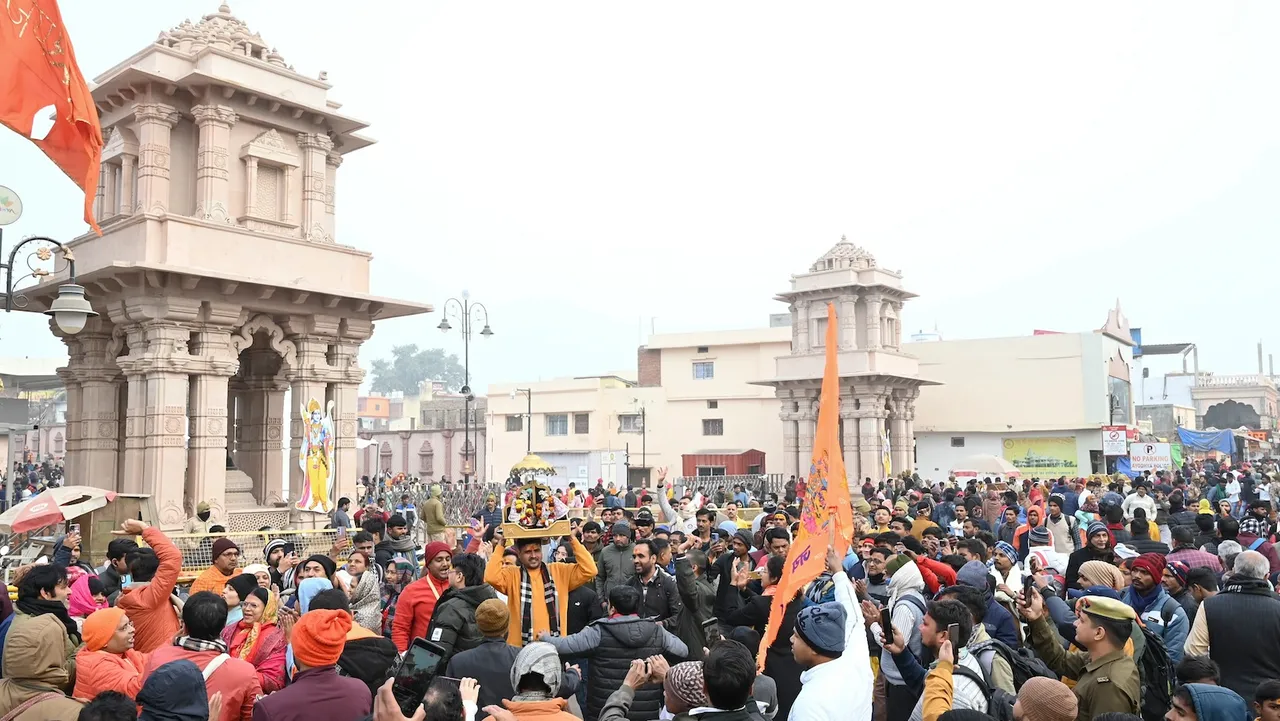 Devotees on the way to offer prayers at the Ram temple on the first day of the New Year 2025 in Ayodhya on Wednesday, Jan. 1, 2025.