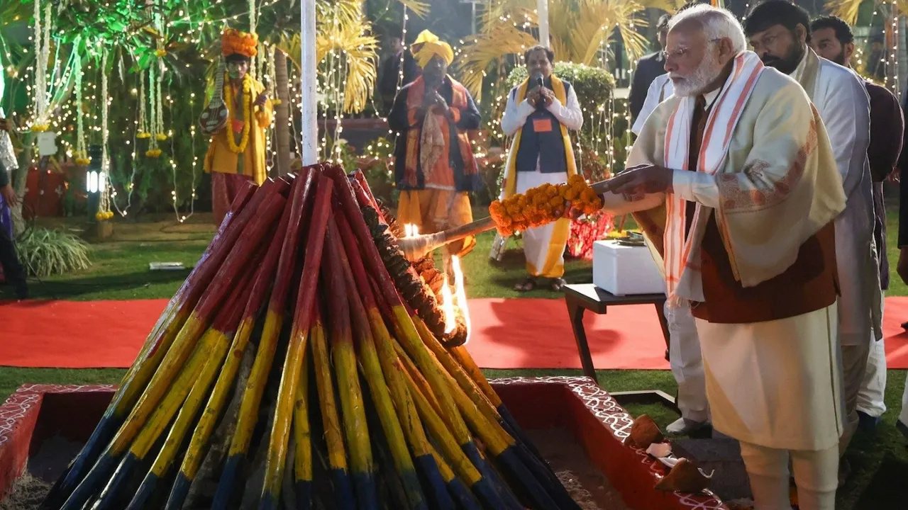 Narendra Modi lights the 'Bhogi' fire during the Sankranti celebration in New Delhi on January 13, 2025.