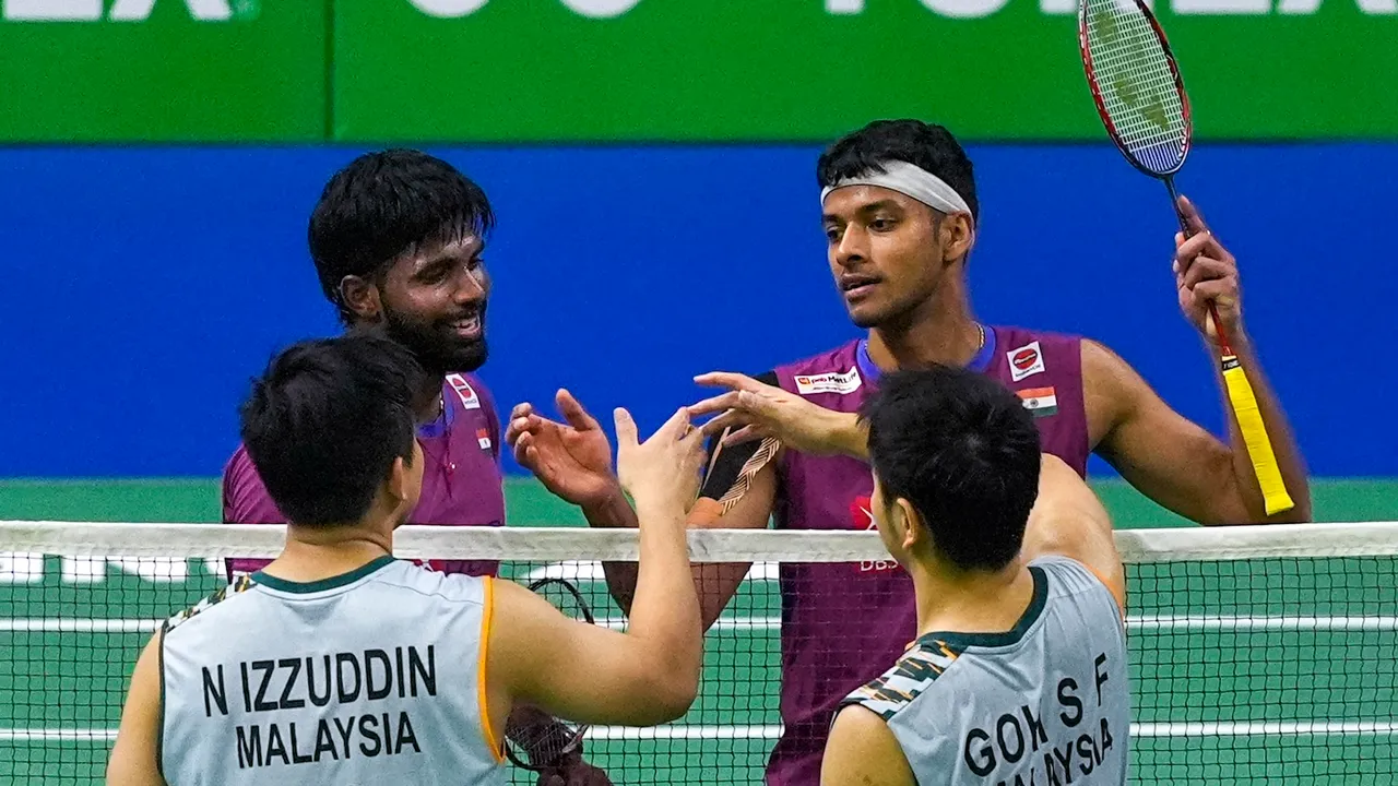 Satwiksairaj Rankireddy and Chirag Shetty congratulate Malaysia's Goh Sze Fei and Nur Izzuddin after losing the men's doubles semi-final match at the India Open 2025 badminton tournament, in New Delhi, Saturday, Jan. 18, 2025.