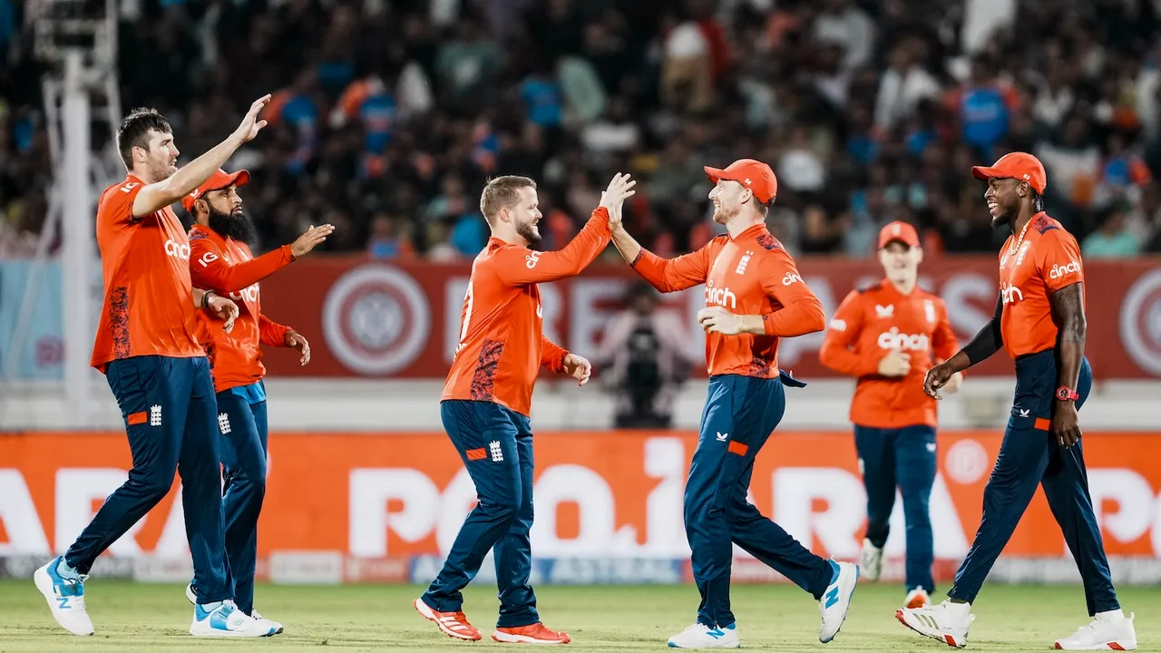 England's players celebrate the dismissal of India's Washington Sundar during the third T20 cricket match between India and England at the Niranjan Shah Stadium in Rajkot on Tuesday, Jan. 28, 2025.