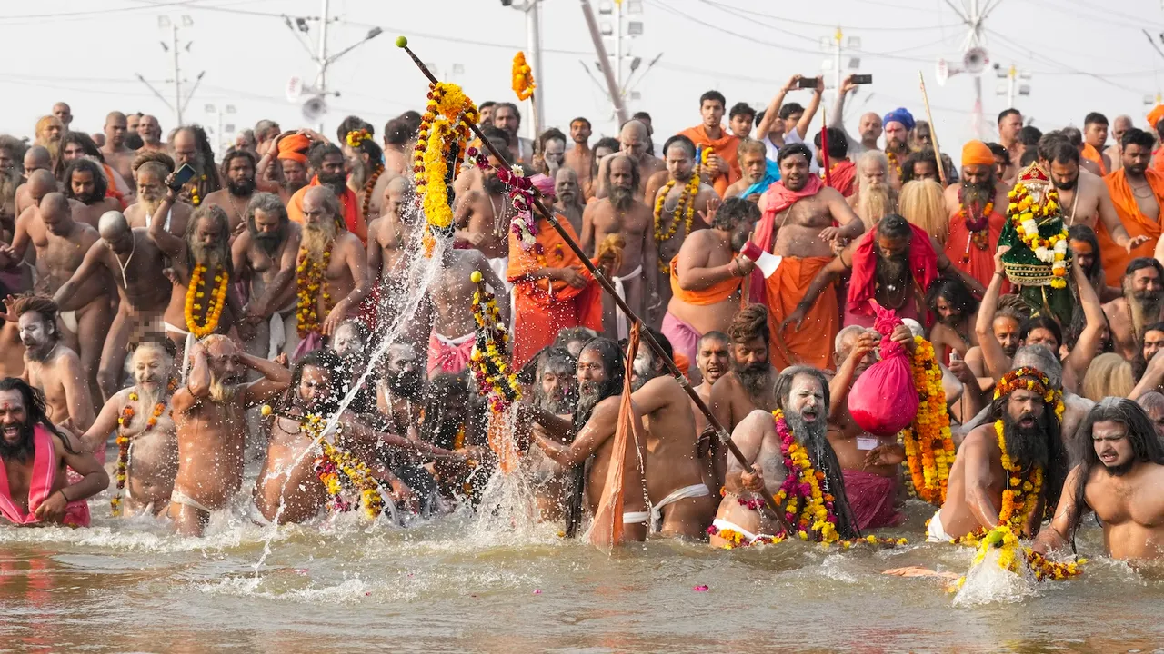 'Sadhus' of the 'Juna Akhara' take a holy dip at the Triveni Sangam, the confluence of the Rivers Ganges, Yamuna, and mythical Saraswati, on the occasion of 'Mauni Amavasya', during the ongoing Maha Kumbh Mela on Wednesday, Jan. 29, 2025.