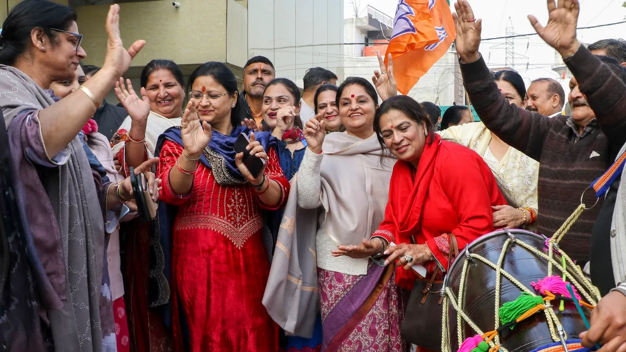 BJP women leaders celebrate party's lead in the Delhi Assembly elections, at party headquarters in Jammu on Saturday, Feb. 8, 2025.
