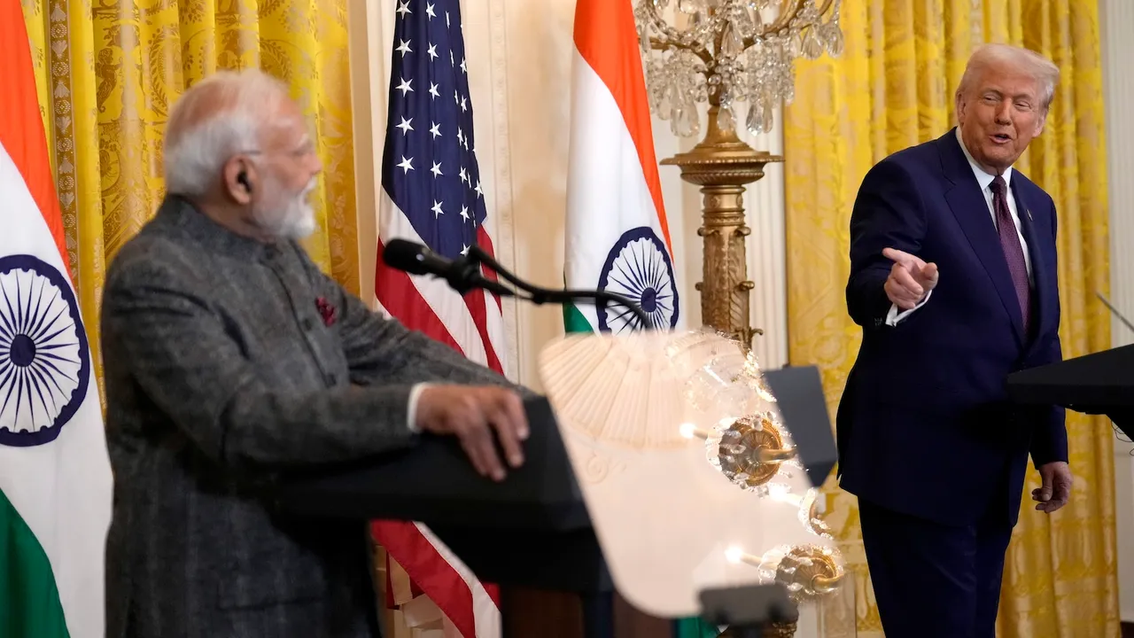 US President Donald Trump, right, speaks as India's Prime Minister Narendra Modi listens during a news conference in the East Room of the White House on Thursday, Feb. 13, 2025, in Washington.