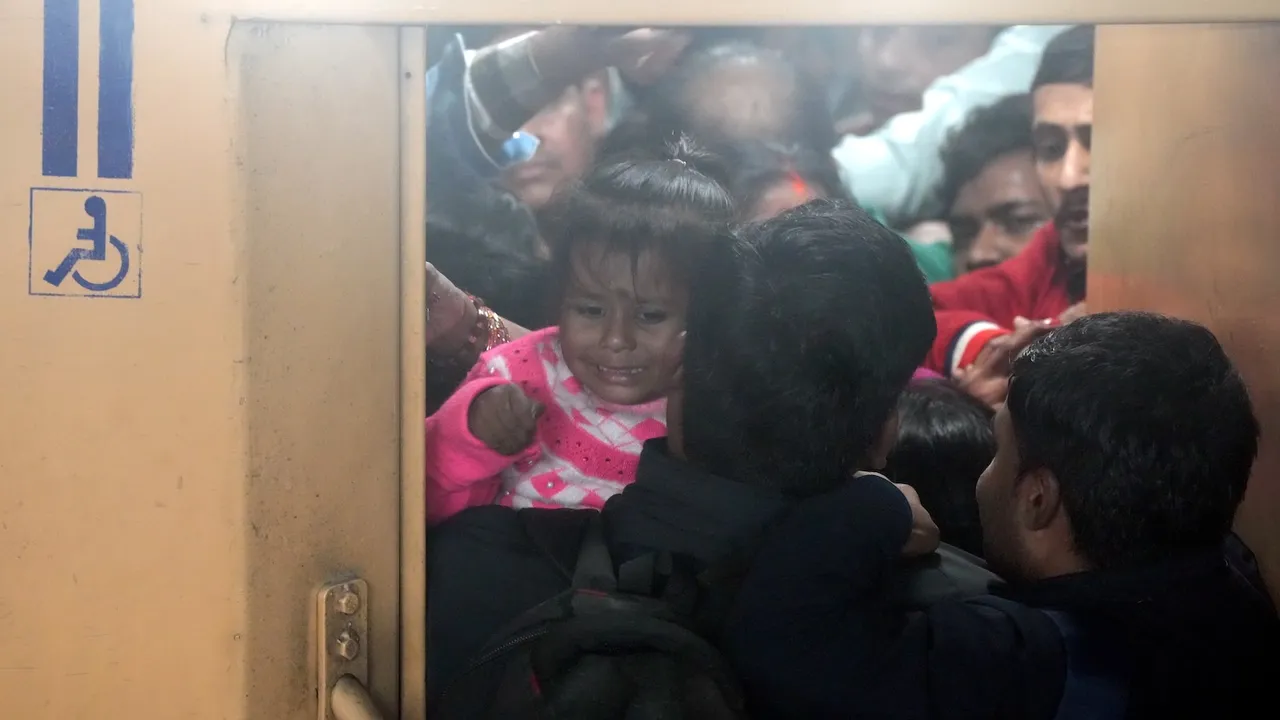 Heavy rush of passengers to catch a train for Mahakumbh at the New Delhi railway station on Saturday, Feb. 15, 2025.