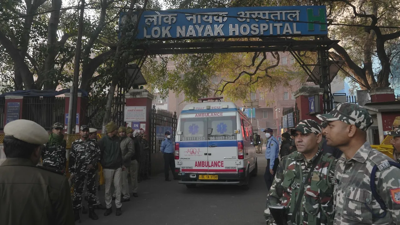 Security personnel stand guard outside the Lok Nayak Hospital, where injured victims of the New Delhi Railway Station stampede are admitted in New Delhi on Sunday, Feb. 16, 2025.