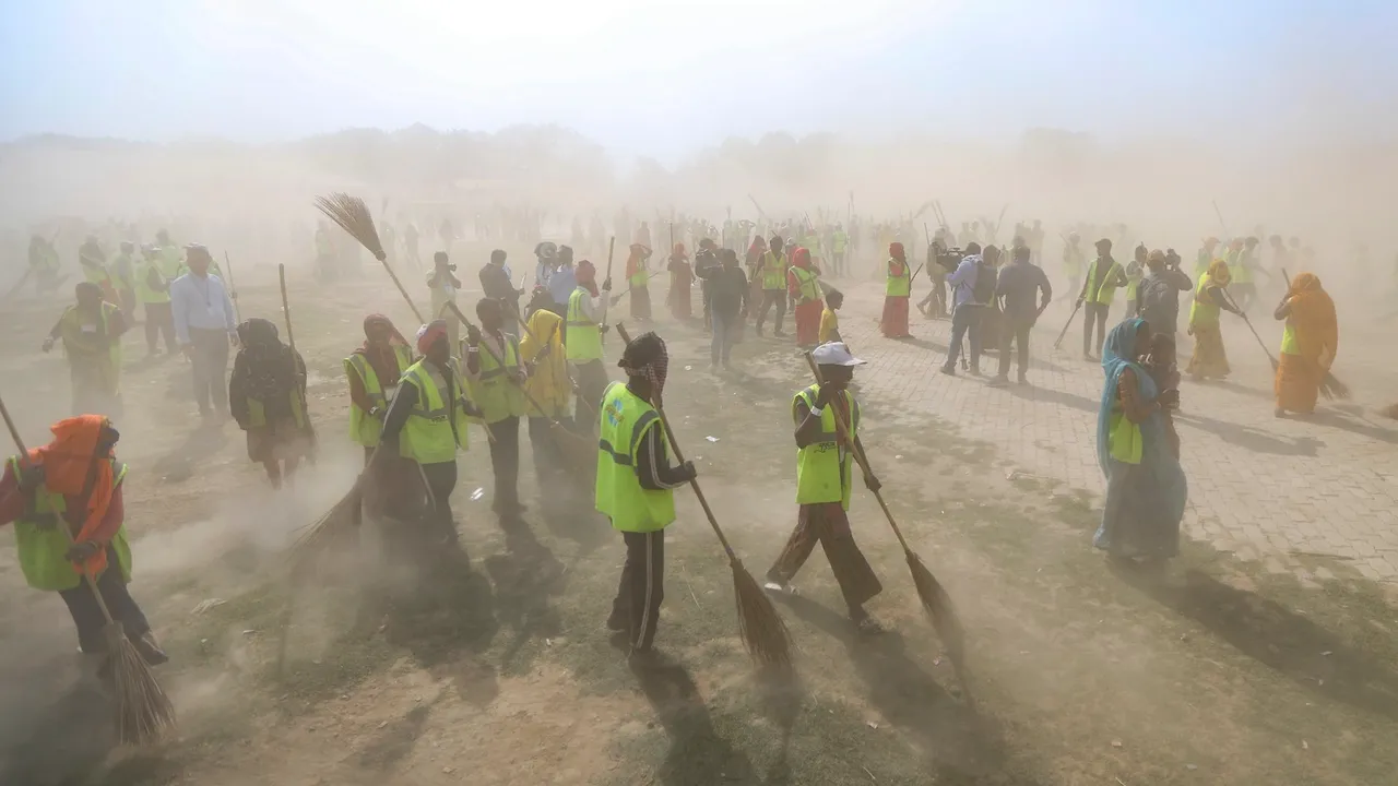 Sanitation workers take part in a cleanliness drive during the ongoing Maha Kumbh Mela 2025 in Prayagraj on Monday, Feb. 24, 2025.