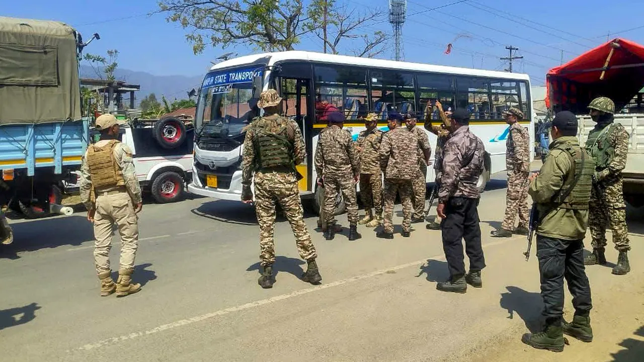 Security personnel stand guard amid protests and blockades by Kuki tribe on day one of their Manipur Free Movement, Kangpokpi district, Saturday, March 8, 2025.