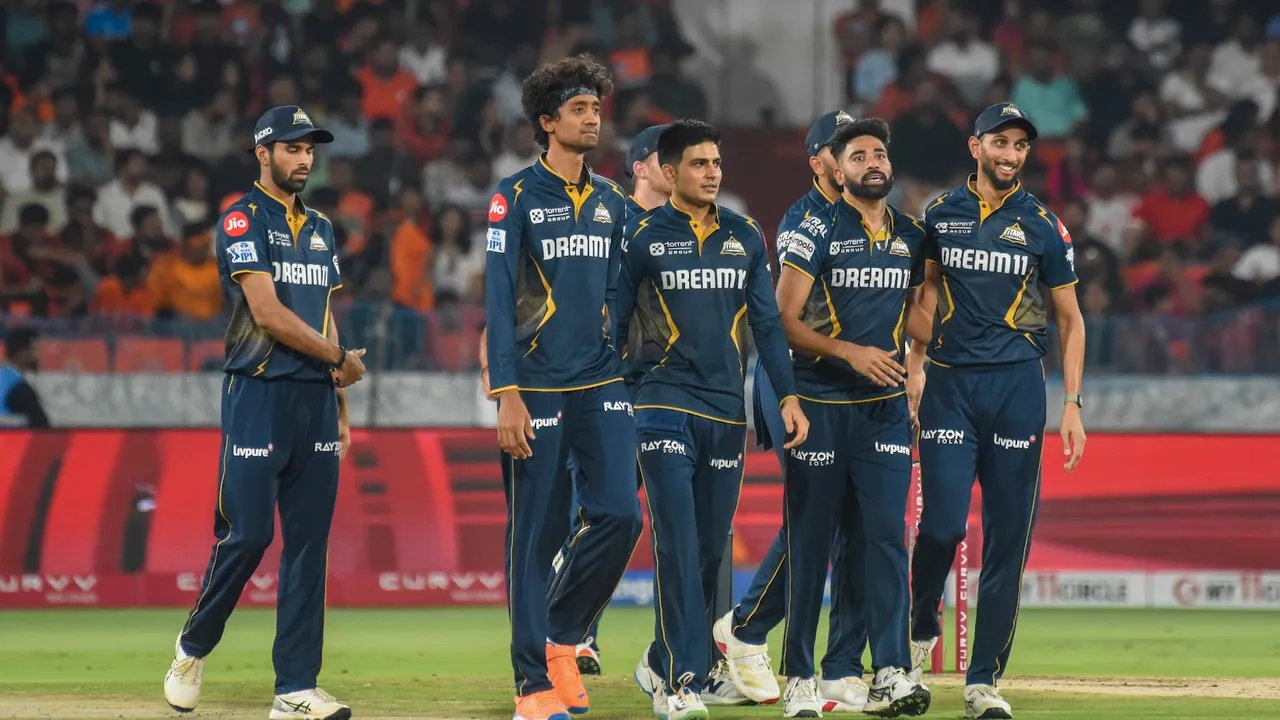 Gujarat Titans' bowler Mohammed Siraj celebrates with teammates after the wicket of Sunrisers Hyderabad's batter Abhishek Sharma at Rajiv Gandhi International Cricket Stadium in Hyderabad on Sunday, April 6, 2025.