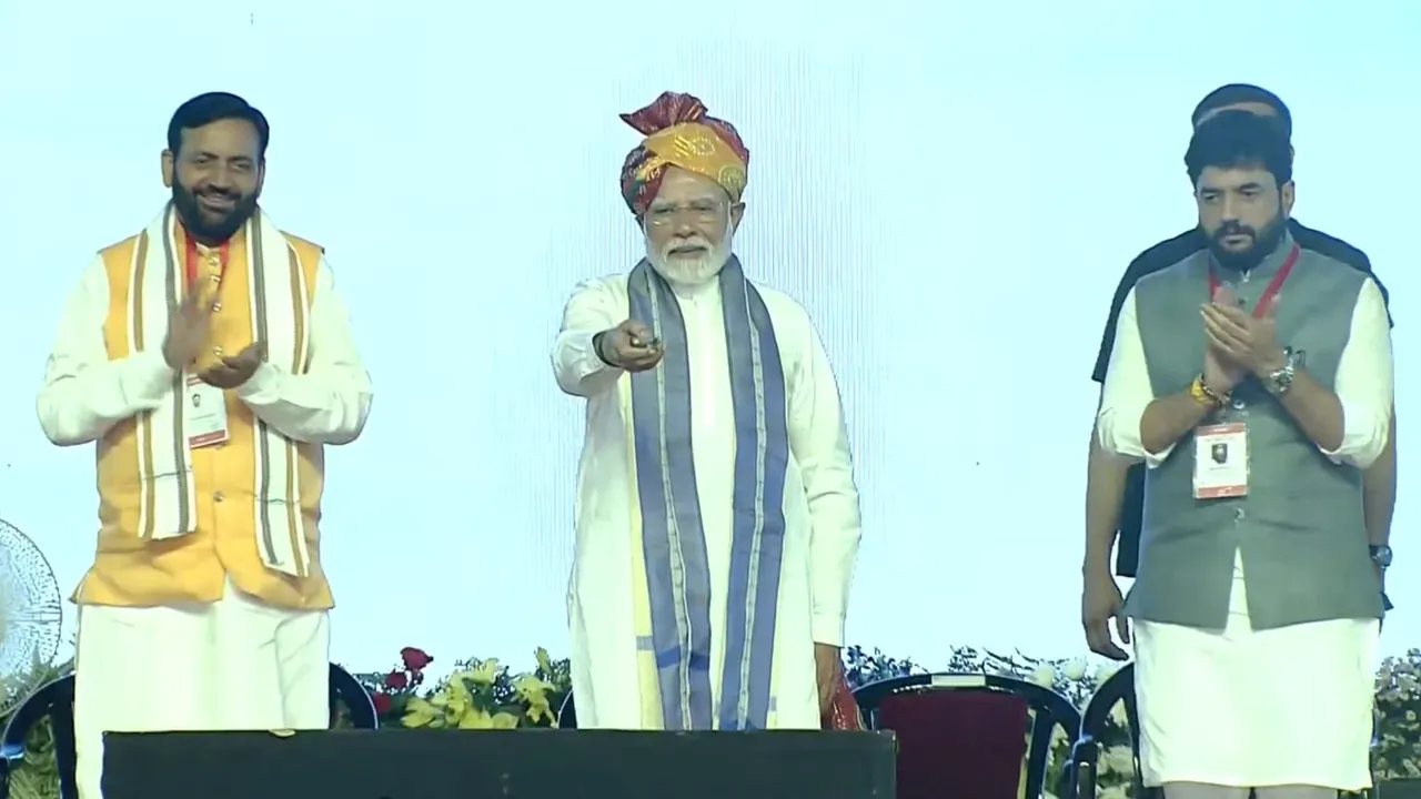 PM Narendra Modi and Haryana CM Nayab Singh Saini during flagging off ceremony of a commercial flight from Hisar to Ayodhya and foundation stone laying of the new terminal building at the Hisar airport, in Hisar, Haryana.