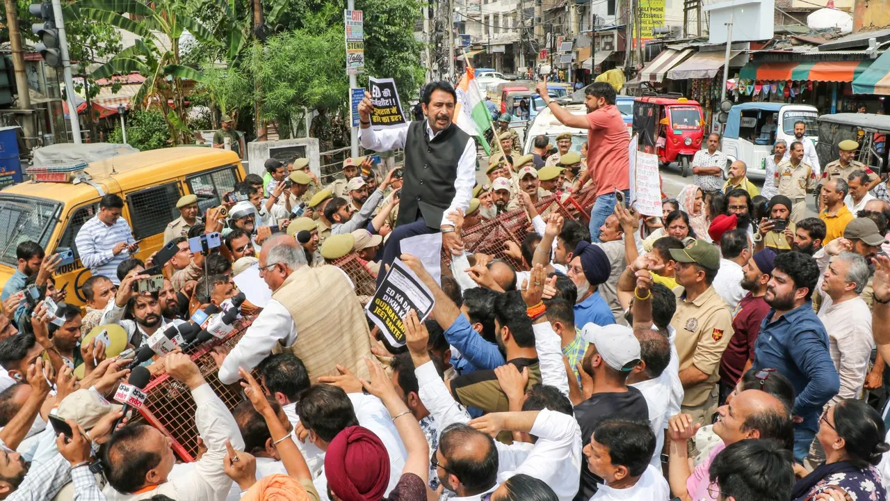 INC cadres stage a protest after the Enforcement Directorate filed a chargesheet against Congress Parliamentary Party Chairperson Sonia Gandhi and LoP in the Lok Sabha and party leader Rahul Gandhi in the National Herald case, in Jammu.