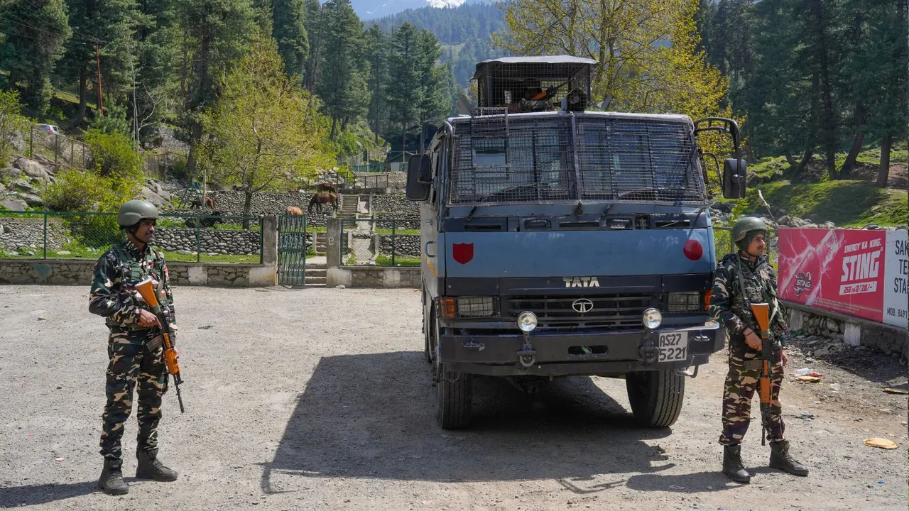 Security personnel stand guard a day after a terrorist attack in Pahalgam, J & K.