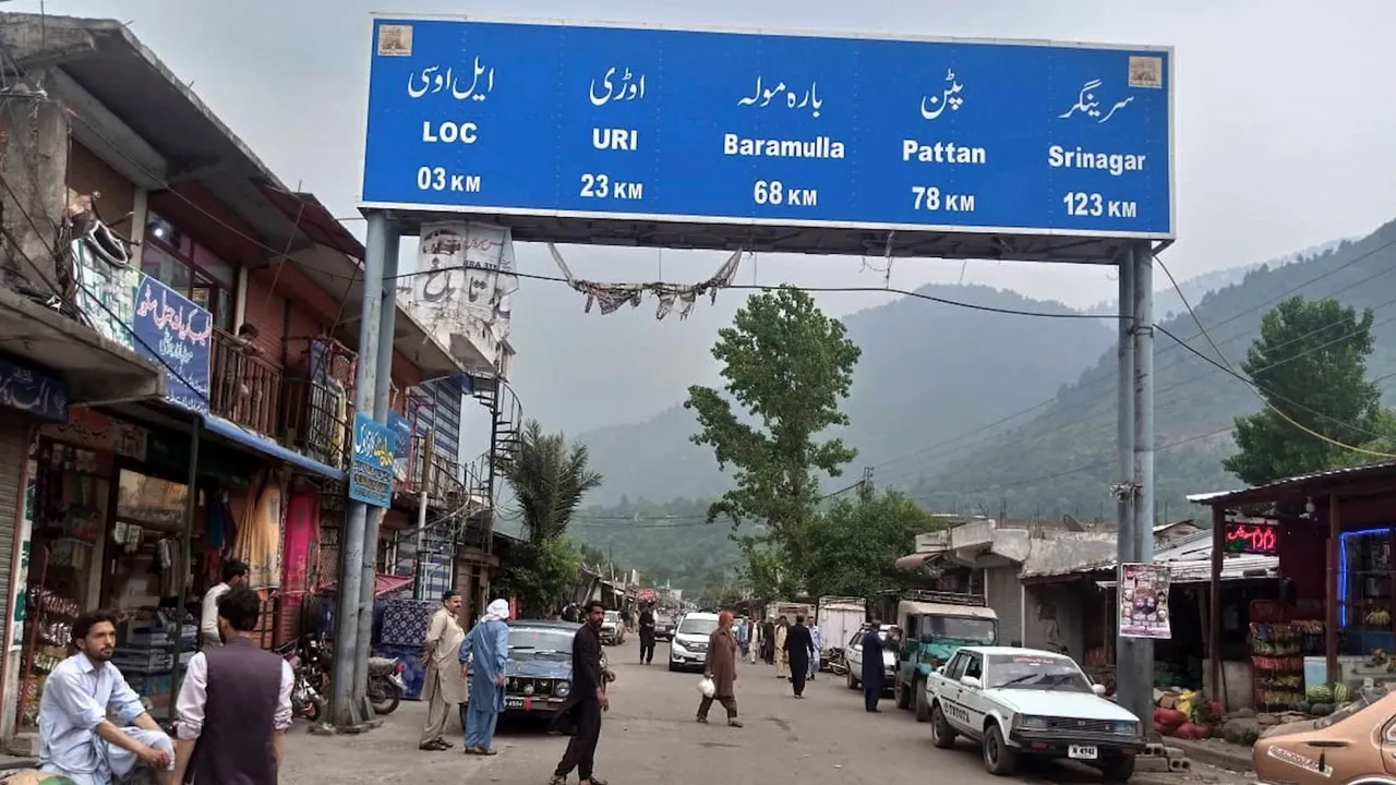 Local residents walk through the main bazaar of Chakothi, near Line of Control, the de facto border dividing Pakistan and Indian Kashmir, some 61 kilometers (38 miles) from Muzaffarabad, the capital of Pakistan controlled Kashmir on Thursday, May 1, 2025.