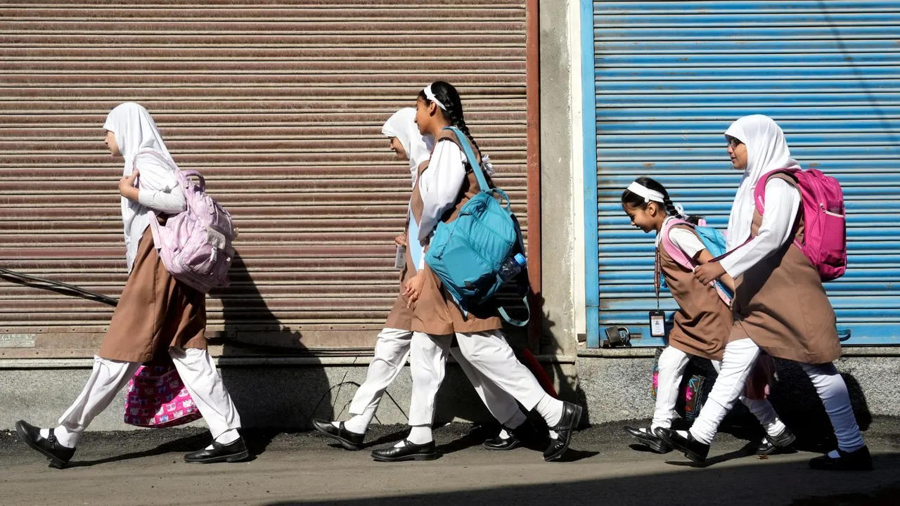 Students head to their school as educational institutions reopen in non-border districts of Jammu and Kashmir after remaining closed for nearly a week due to India-Pakistan tensions, in Srinagar.