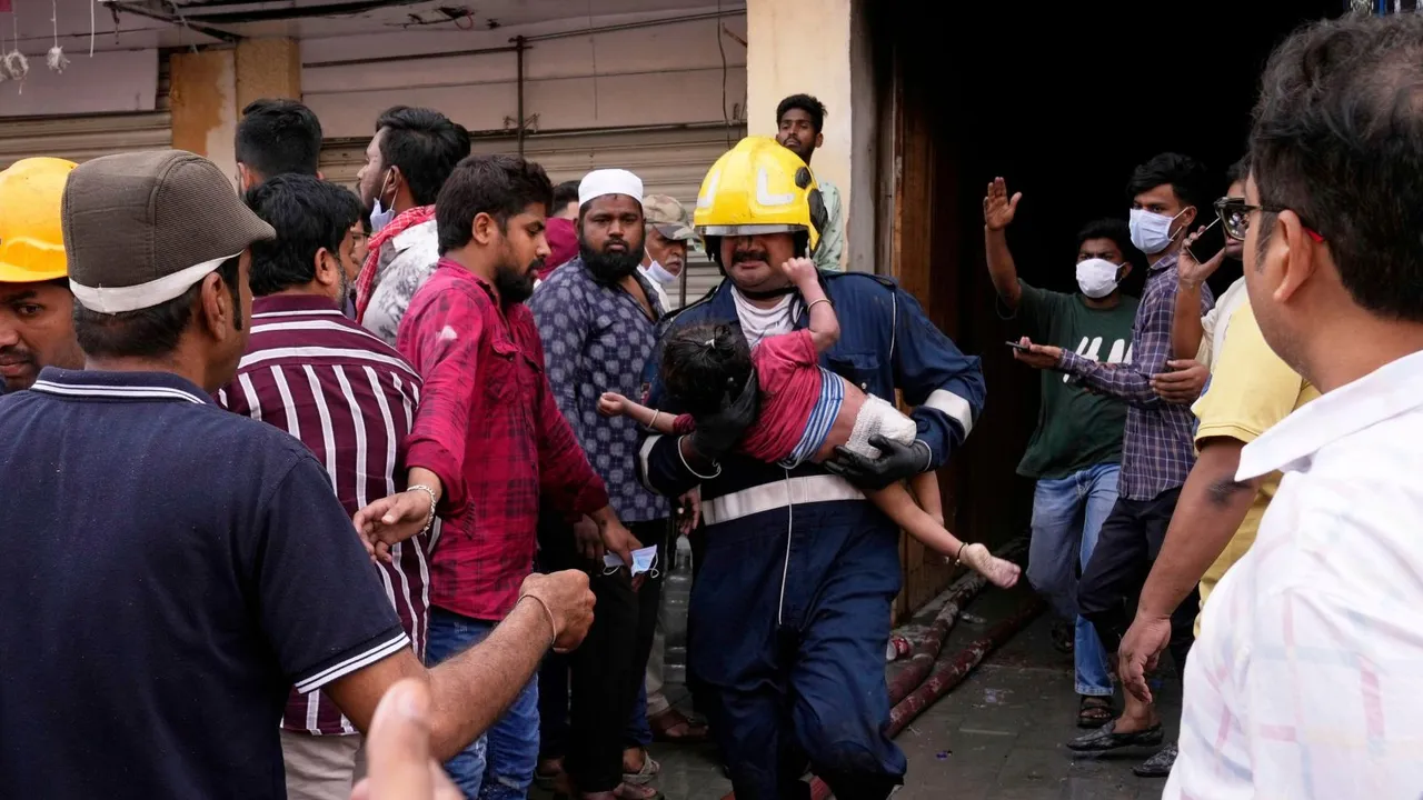 A young child, who was injured when a building caught fire near the Charminar area in Hyderabad.