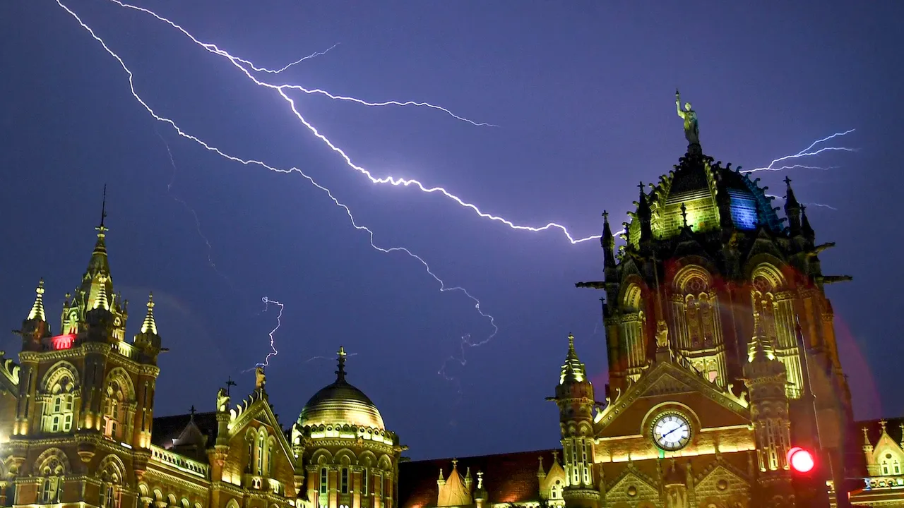 Thunderstorm lights up the sky above the Chhatrapati Shivaji Terminus during pre-monsoon rains in Mumbai on Tuesday, May 20, 2025.
