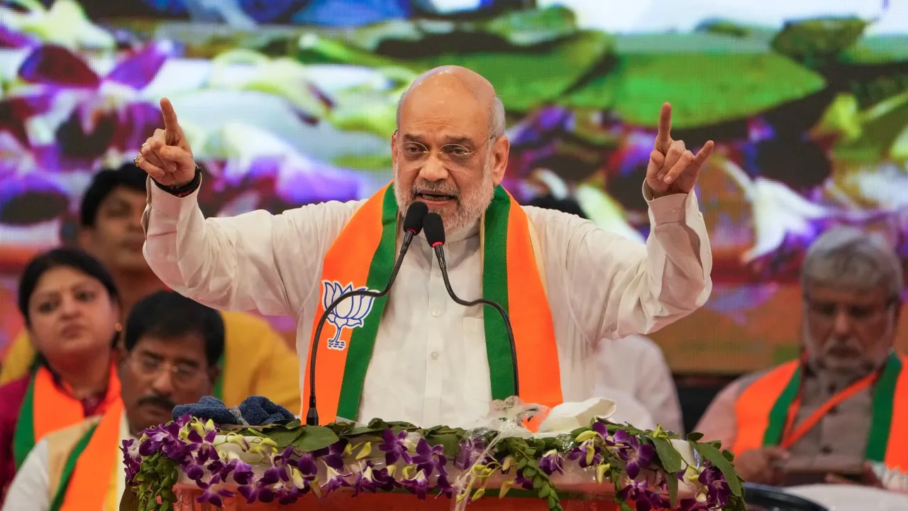  Union Home Minister and senior BJP leader Amit Shah addresses an organisational meeting of the party at Netaji Indoor Stadium in Kolkata