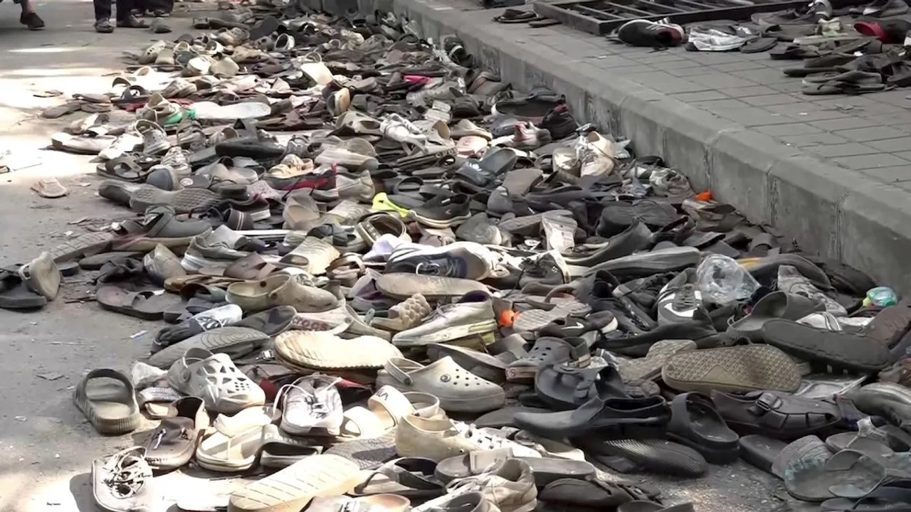 Footwear lie on the ground outside the Chinnaswamy Stadium a day after the stampede, following a large gathering of fans for the felicitation of IPL 2025 winning Royal Challengers Bengaluru team