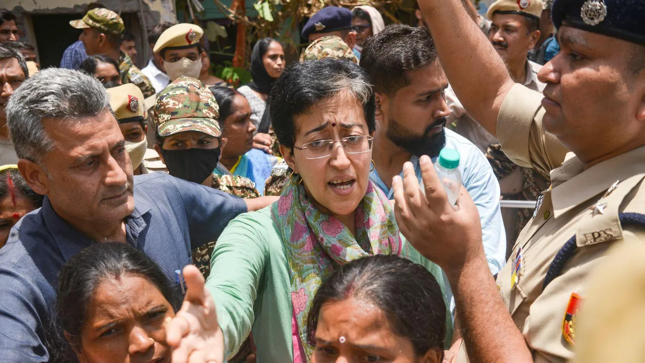 LoP in Delhi Assembly Atishi arrives at the Bhoomiheen jhuggi-jhopri (JJ) camp, at Kalkaji, in New Delhi, Tuesday, June 10, 2025. Eviction notices by the Delhi Development Authority have been pasted at houses in the jhuggi-jhopri camp, warning 'encroachers' to leave the spot within three days, or face action.
