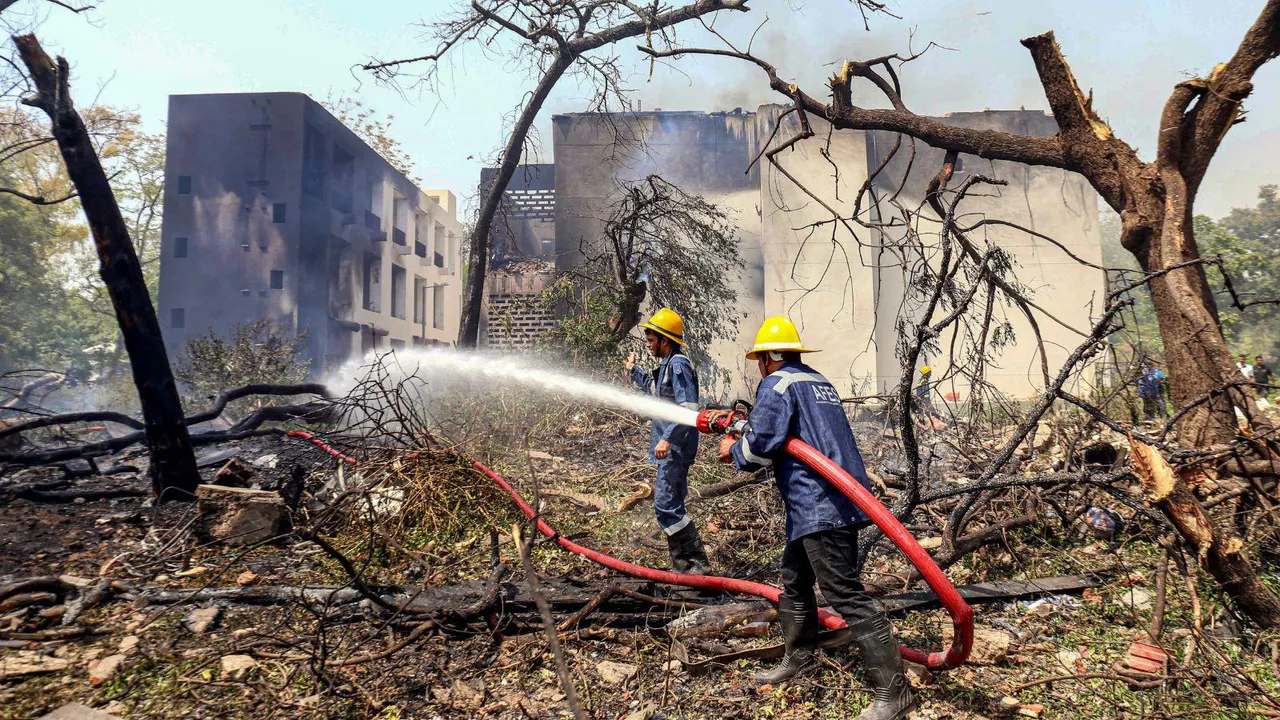 Firefighting team at the spot after a London-bound Air India plane crashed moments after taking off from the Ahmedabad airport