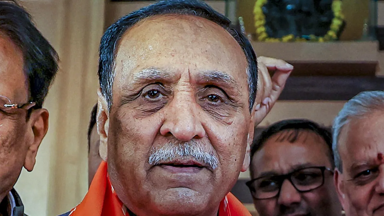 In this Friday, Feb. 21, 2025 file image former Gujarat Chief Minister Vijay Rupani being welcomed by Rajasthan BJP President Madan Rathore as he arrives for a meeting at BJP office in Jaipur.