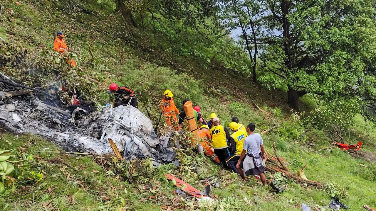 NDRF and SDRF personnel at the spot after a helicopter crashed near the Kedarnath shrine, in Rudraprayag district, Uttarakhand