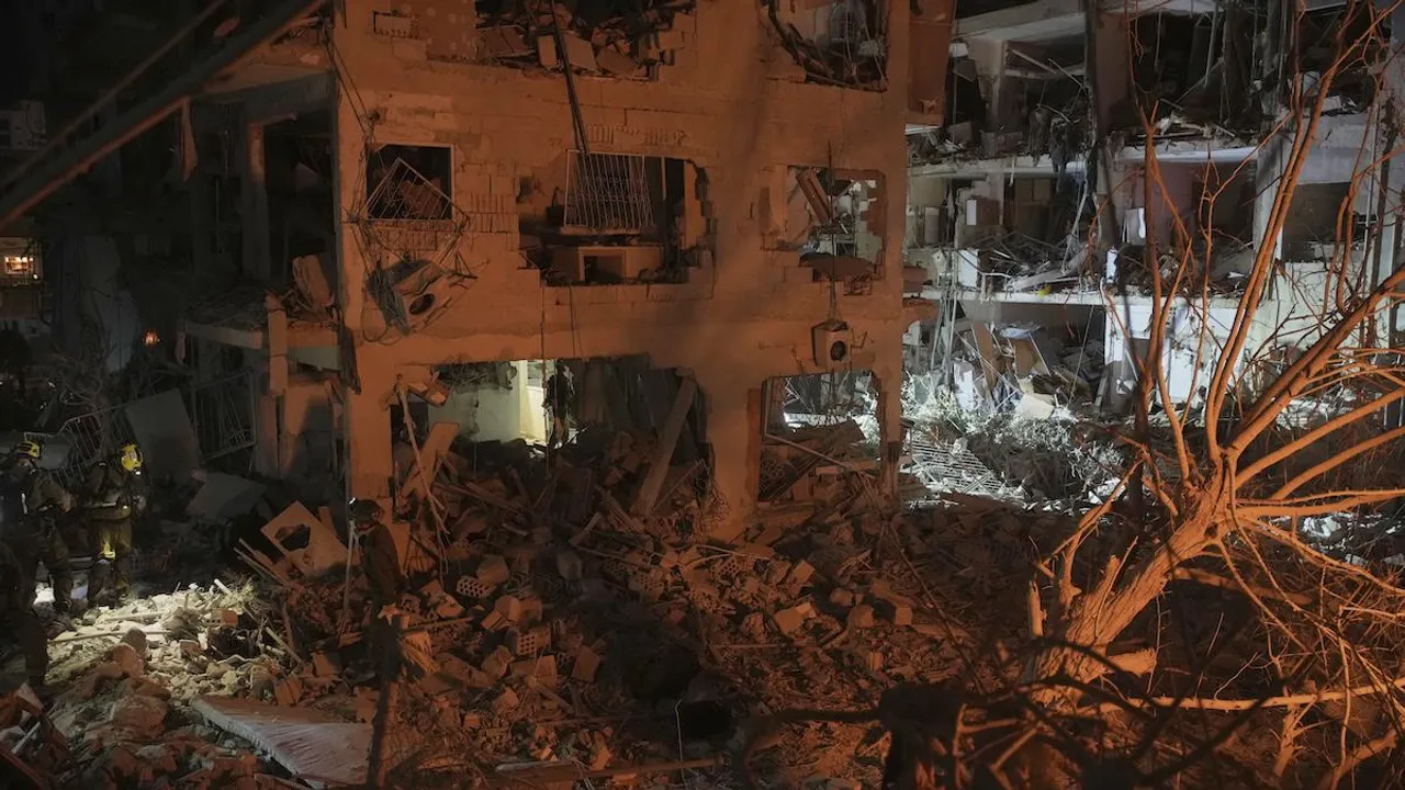 Israeli security forces inspect destroyed buildings that were hit by a missile fired from Iran, near Tel Aviv, Israel on Sunday, June 15,