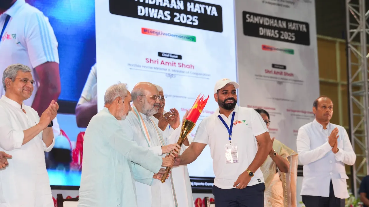Union Home Minister Amit Shah, Union Minister of Culture and Tourism Gajendra Singh Shekhawat and others during an event on 'Samvidhan Hatya Diwas', marking the imposition of Emergency by former prime minister Indira Gandhi on this day in 1975, at Thyagaraj Sports Complex, in New Delhi, Wednesday, June 25, 2025