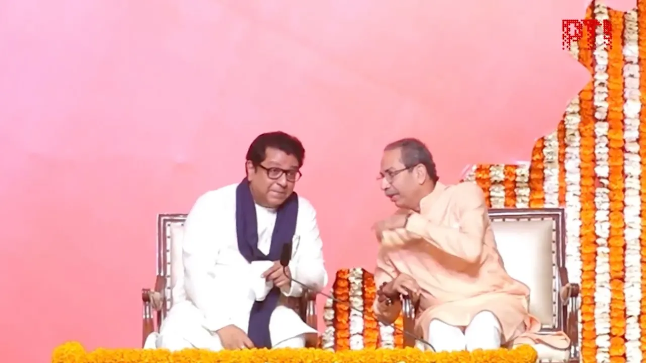 Uddhav (right) and Raj Thackeray shake hands as they hold a joint victory gathering, titled 'Awaj Marathicha' on Saturday, July 5, 2025.