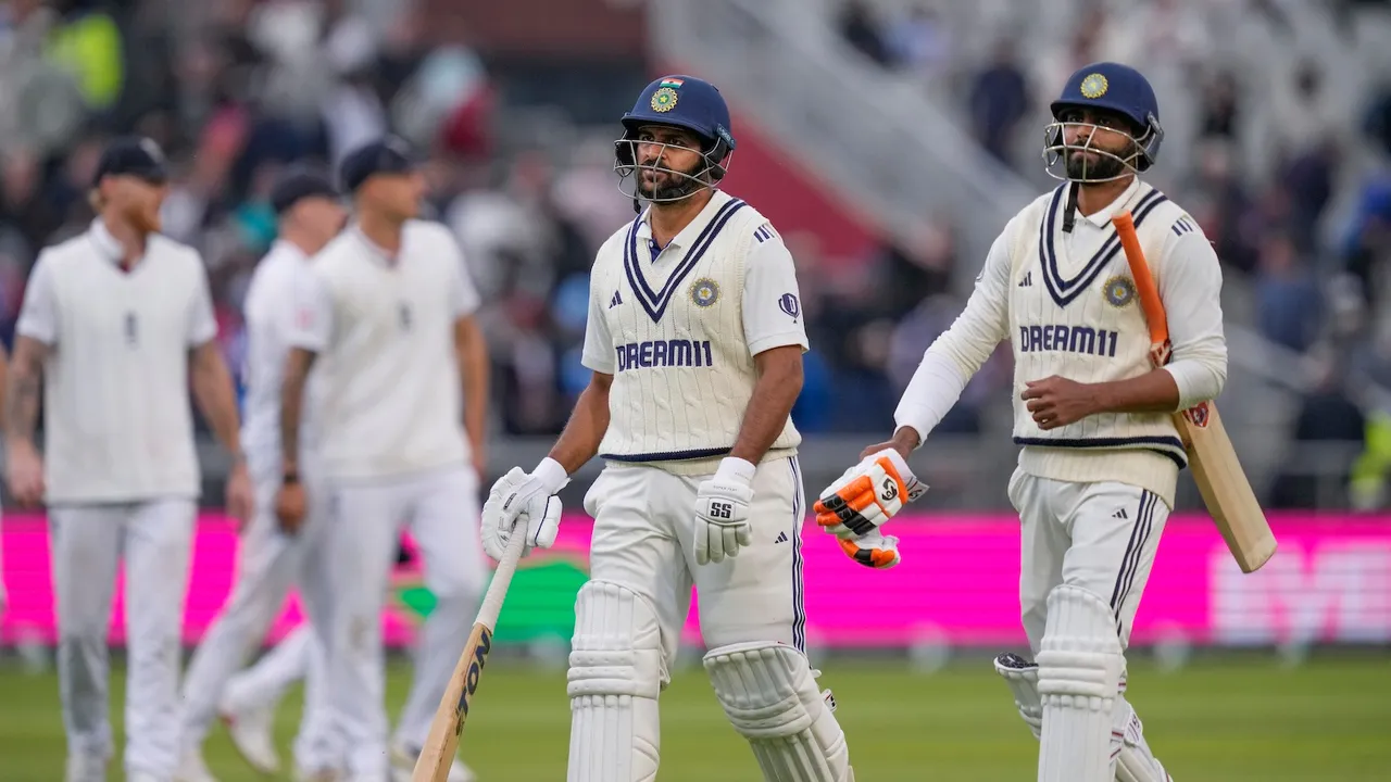 Ravindra Jadeja and Shardul Thakur return to pavilion after the end of play on day one of the fourth test cricket match between India and England, at the Old Trafford Cricket Ground, in Manchester, Wednesday, July 23, 2025.
