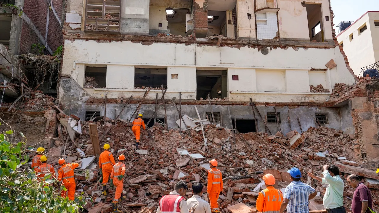 Rescue operation after a building collapsed near Sadbhavna Park in Daryaganj, New Delhi, Wednesday, Aug. 20, 2025.